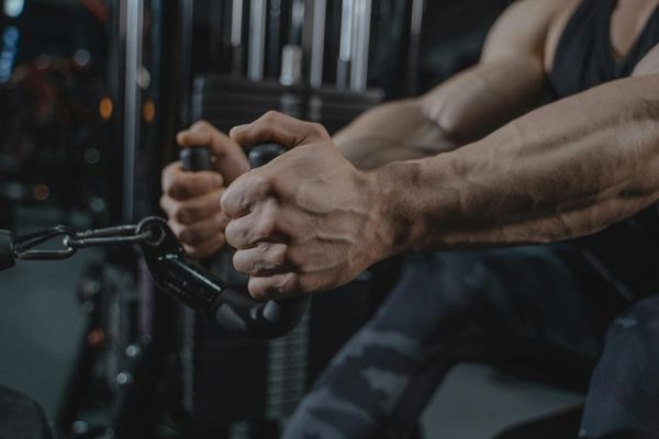 Close up of masculine hands during a stability exercise session.